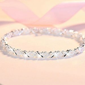 Sterling silver and CZ heart symbol infinity bracelet.